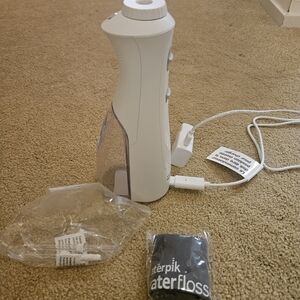 NWOT Waterpik Rechargeable Cordless Pearl Water Flosser